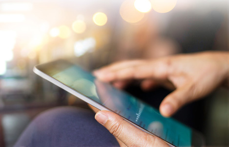 Businessman using tablet at night time